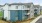 Stylish three-story luxury apartment building with blue and white siding at Colina Weho in Birmingham, AL