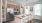 Spacious designer kitchen at Colina Weho featuring granite countertops, stainless steel appliances, pendant lighting, and island seating.