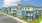 Sleek modern apartment community with balconies, brick accents, and lush landscaping at Colina Weho in Birmingham, AL