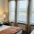 Bedroom with natural lighting and high ceilings